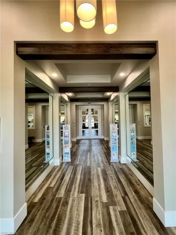 Entry area to Amenities where you can find a conference room, 2 story gym, movement room, kids room, cafe, spa services, and on site property manager offices.