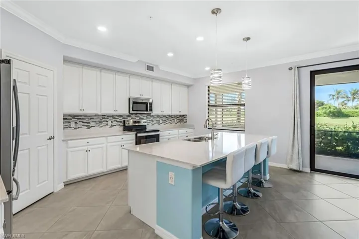 Kitchen features stainless appliances, shaker cabinets, quartz counter tops and SO MUCH MORE!