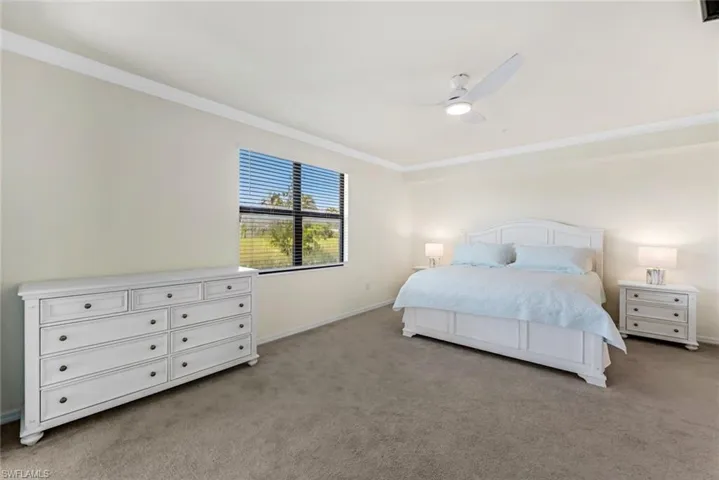 Large primary suite features lake views.