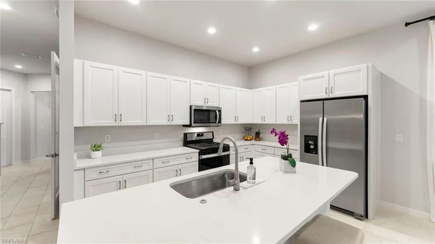 Clean and bright kitchen with natural gas range for the chef!
