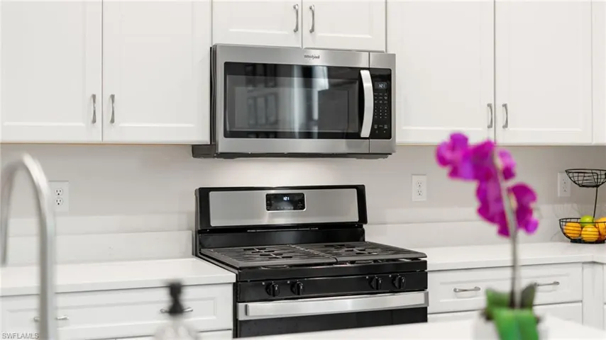 Lovely stainless steel appliances and clean crisp cabinetry!