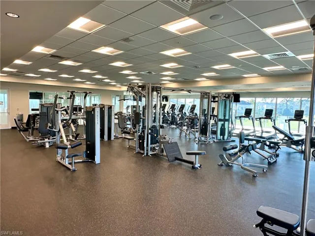 Exercise room featuring a paneled ceiling and visible vents