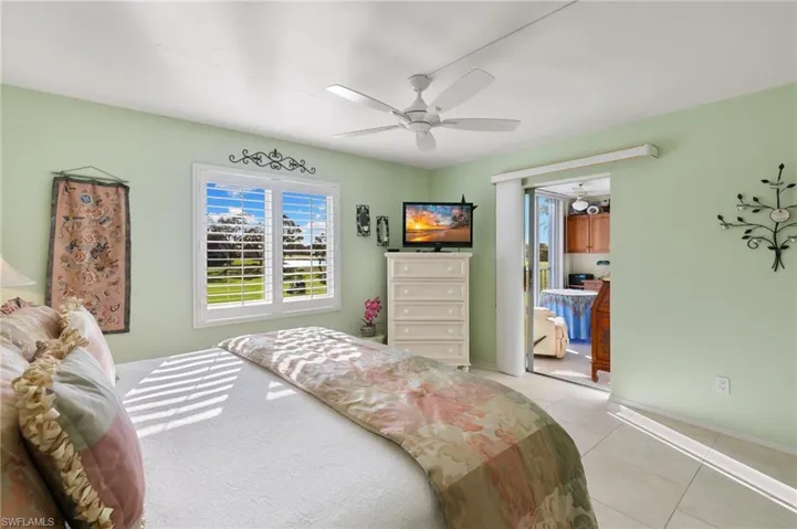 Tiled bedroom with ceiling fan