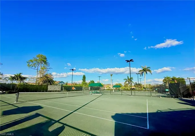 View of tennis court with fence