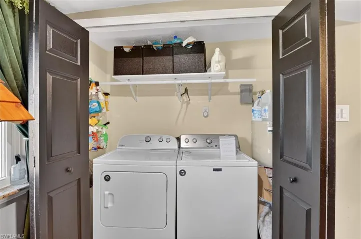 Laundry area featuring separate washer and dryer