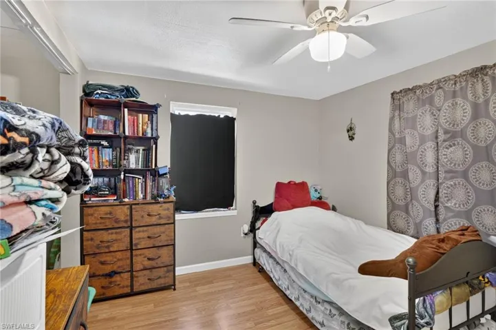 Bedroom featuring light wood finished floors and a ceiling fan