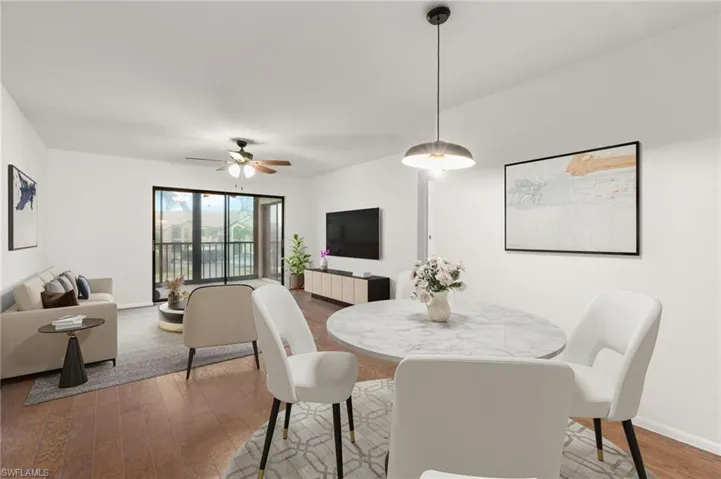 Dining area featuring wood finished floors and a ceiling fan