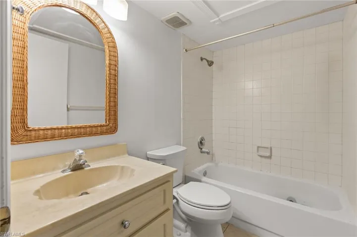 Full bath featuring tub / shower combination and vanity
