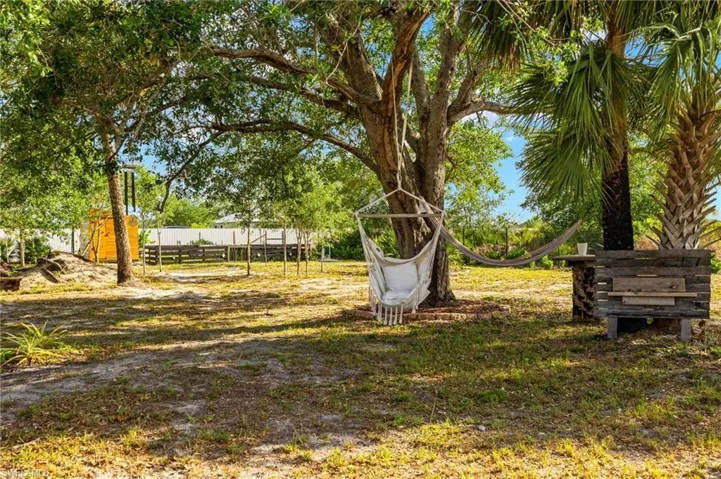 View of yard featuring fence