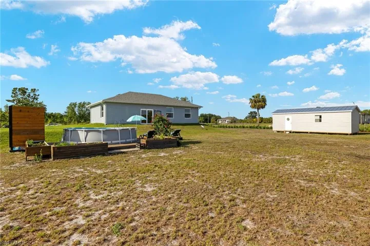 View of yard with an outbuilding