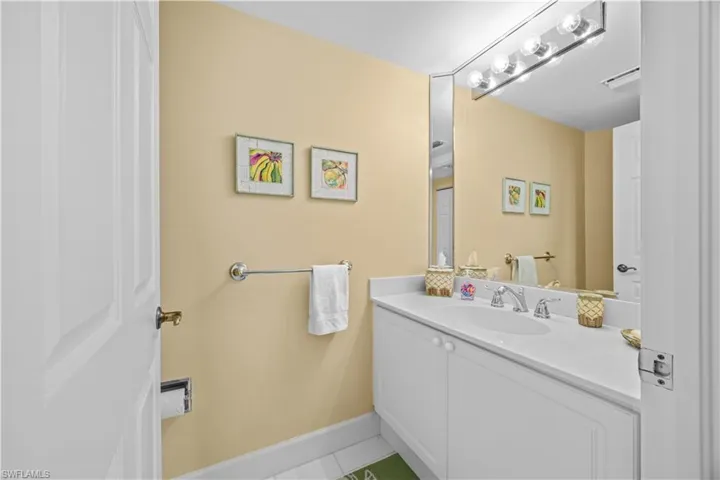 Bathroom with vanity and light tile patterned floors