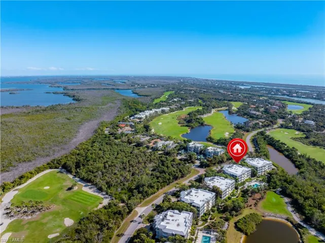 Bird's eye view of a nearby body of water and a golf club
