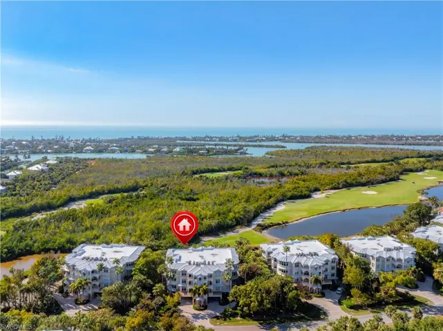 Drone / aerial view of a large body of water and a golf club