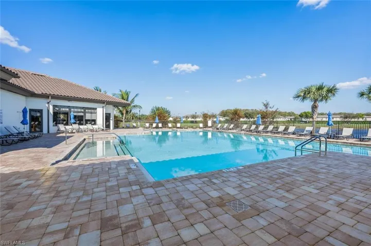 Community pool featuring a patio area