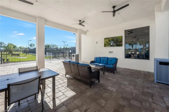 View of patio featuring an outdoor living space, ceiling fan, and outdoor dining area