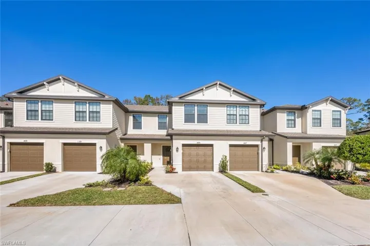 Craftsman inspired home featuring driveway and an attached garage