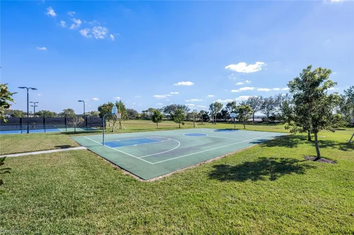 View of basketball court featuring community basketball court and a tennis court