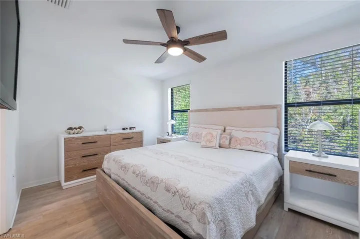 Bedroom featuring light wood-type flooring and ceiling fan