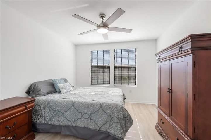Bedroom featuring light wood-type flooring and a ceiling fan
