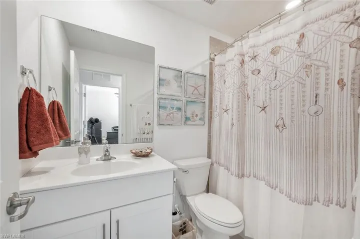 Bathroom with vanity and a shower with curtain