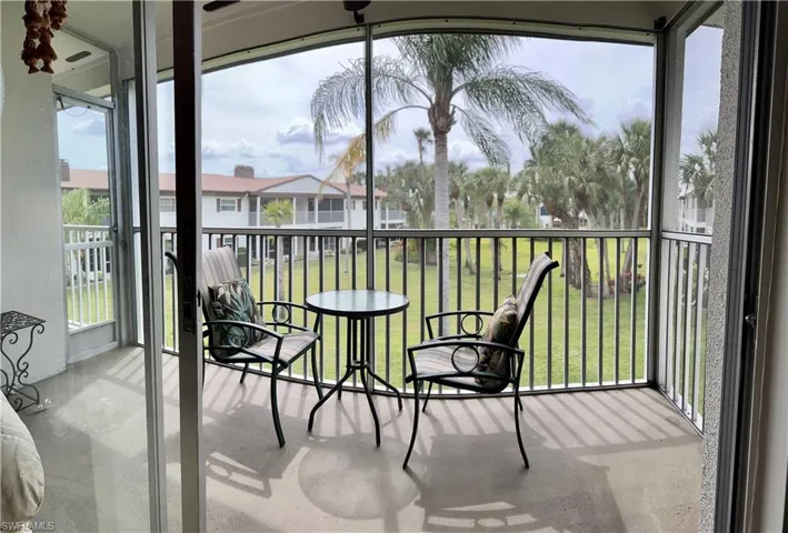 Screened lanai overlooking the well groomed lawns