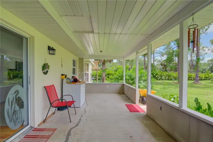 Unfurnished sunroom with washer / clothes dryer