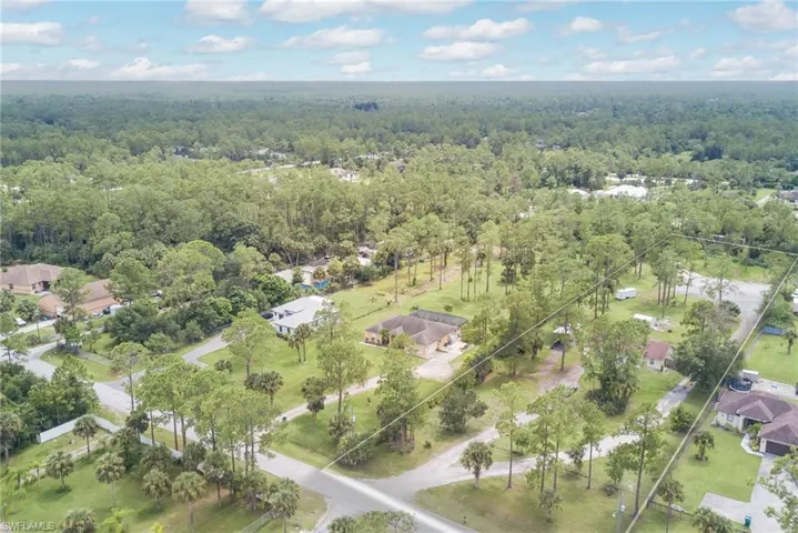 Aerial view of residential area with property parcel outlined