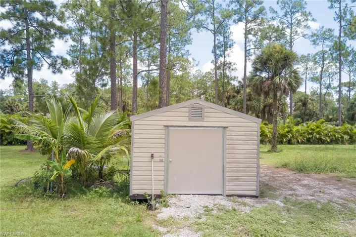 View of shed featuring view of scattered trees