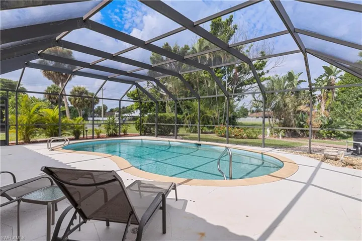 View of pool featuring a patio area and a lanai