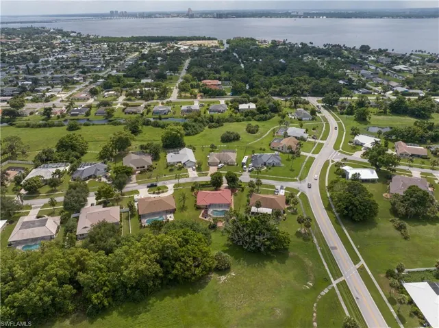Birds eye view of property featuring a water view of river