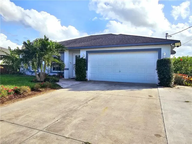 Ranch-style house with a garage