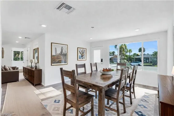 Virtual Staged- Dining room with light wood-type flooring - VIRTUALLY ENHANCED