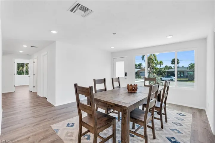 Virtual Staged- Dining room with light wood-type flooring - VIRTUALLY ENHANCED