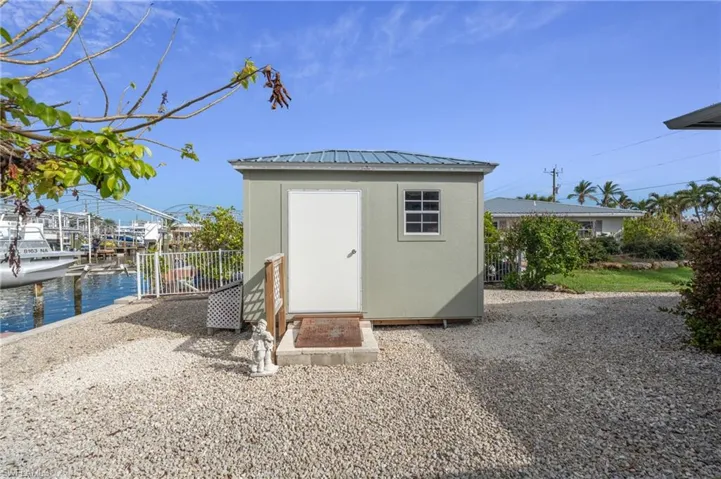 View of outbuilding featuring a water view