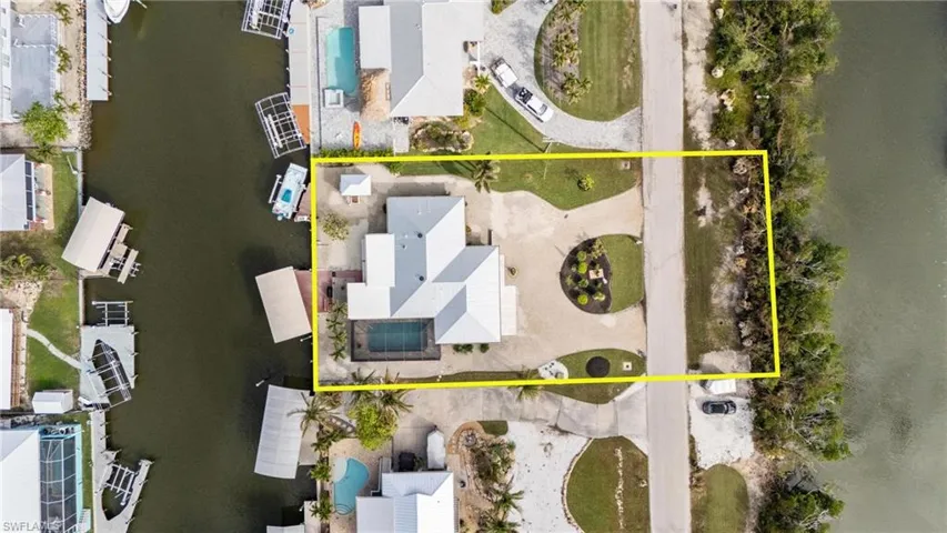Birds eye view of property with a water view. Notice front boundary also is waterfront.