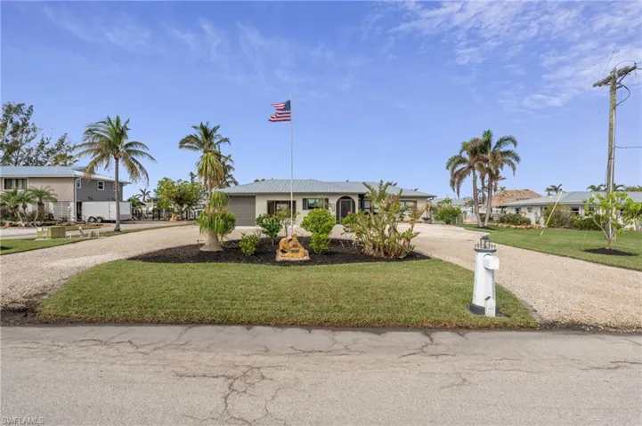 Ranch-style house with a front lawn