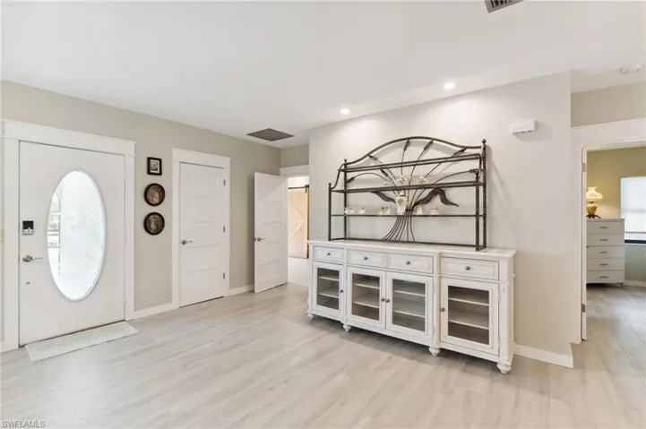 Foyer entrance featuring light hardwood / wood-style flooring