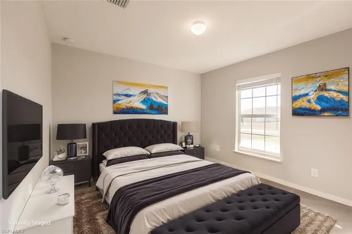 Bedroom with dark carpet