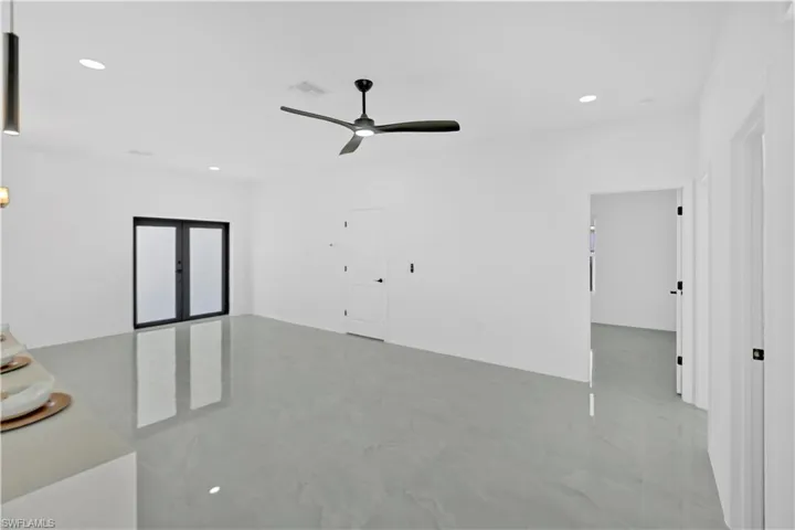 Spare room with recessed lighting and a ceiling fan