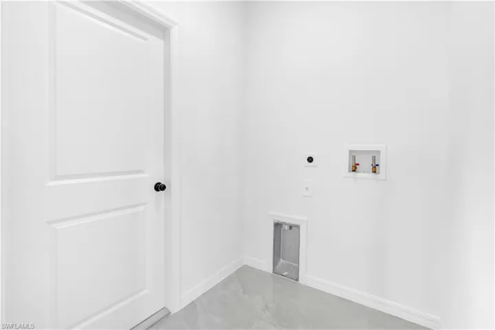 Laundry area featuring hookup for an electric dryer and hookup for a washing machine