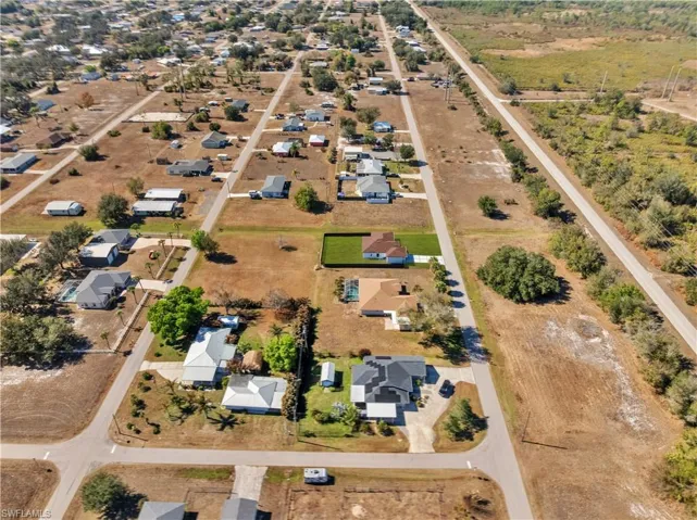 View of property location with nearby suburban area