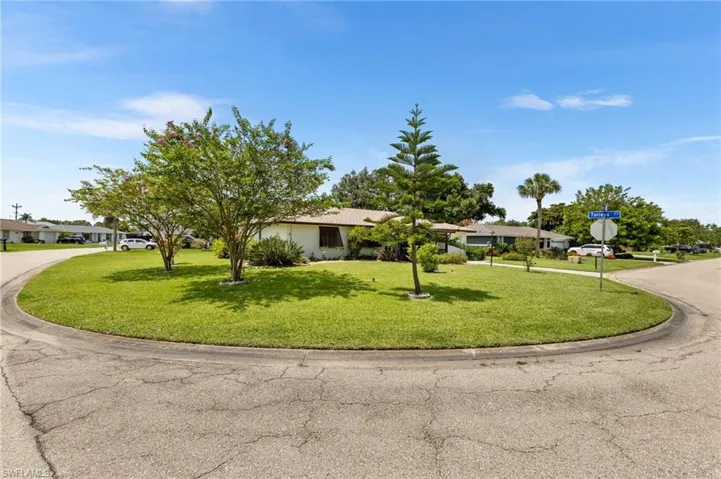 Ranch-style house featuring a front yard and driveway