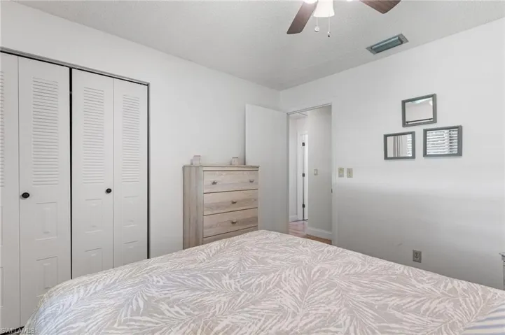Bedroom featuring a closet and a ceiling fan