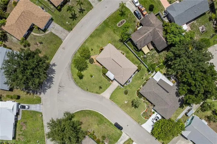 Aerial view of property's location featuring nearby suburban area