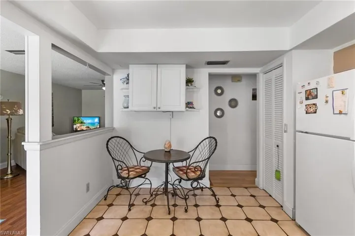 Dining room featuring ceiling fan and light flooring