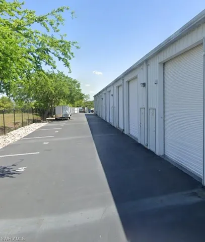 View of street featuring community garages