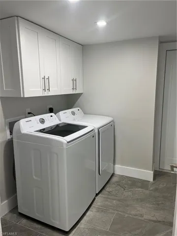 Laundry room with additional cabinets