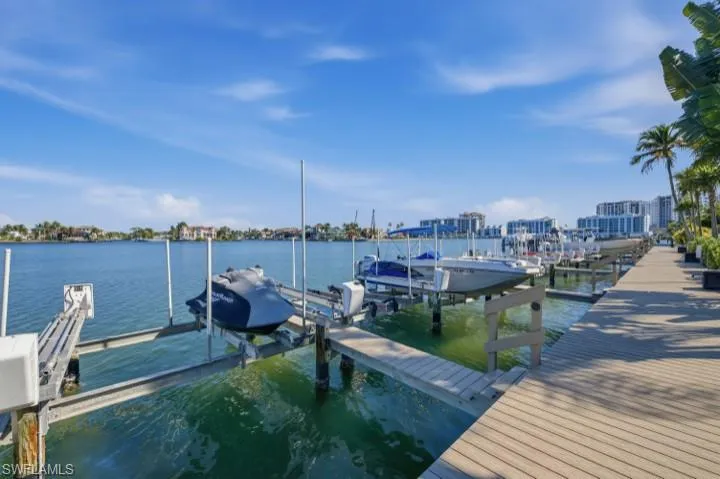Dock area featuring a water view and boat lift