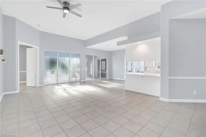 Spare room with ceiling fan, light tile patterned flooring, and sink