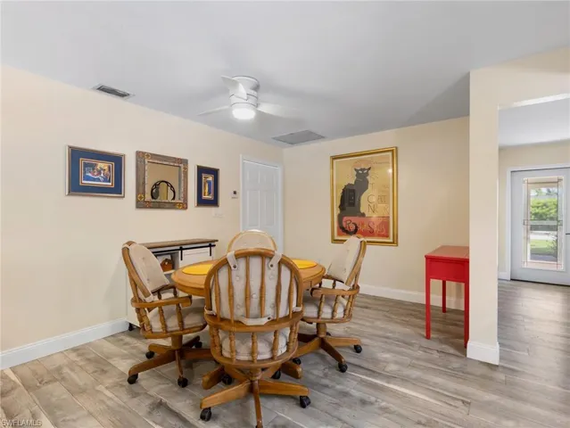 Family room with additional dining/flex area and laundry room through doorway